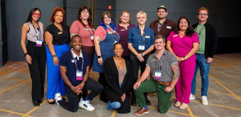 Twelve individuals, all members of the 2024-2025 cohort of ASTC New Leaders Fellowship program, pose for a group photo.